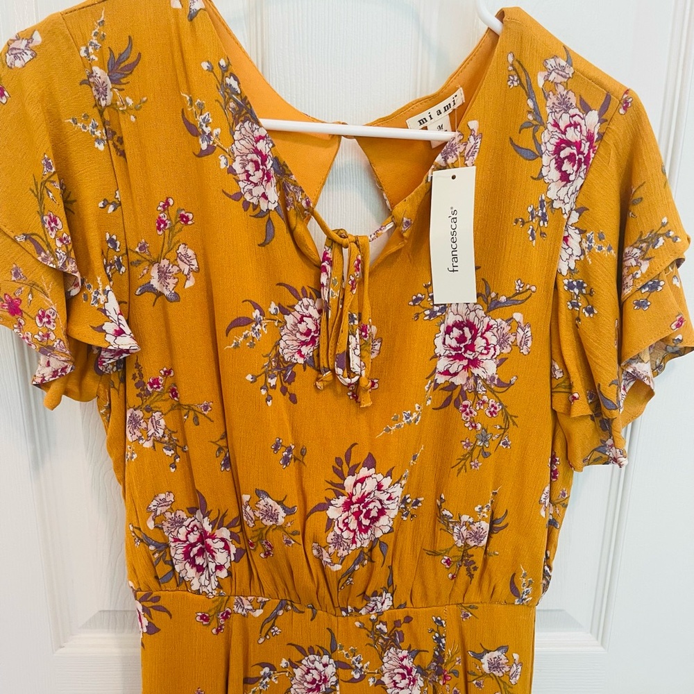 Beautiful mustard yellow floral jumpsuit from Francesca’s collection.